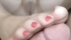 Pink nails footjob