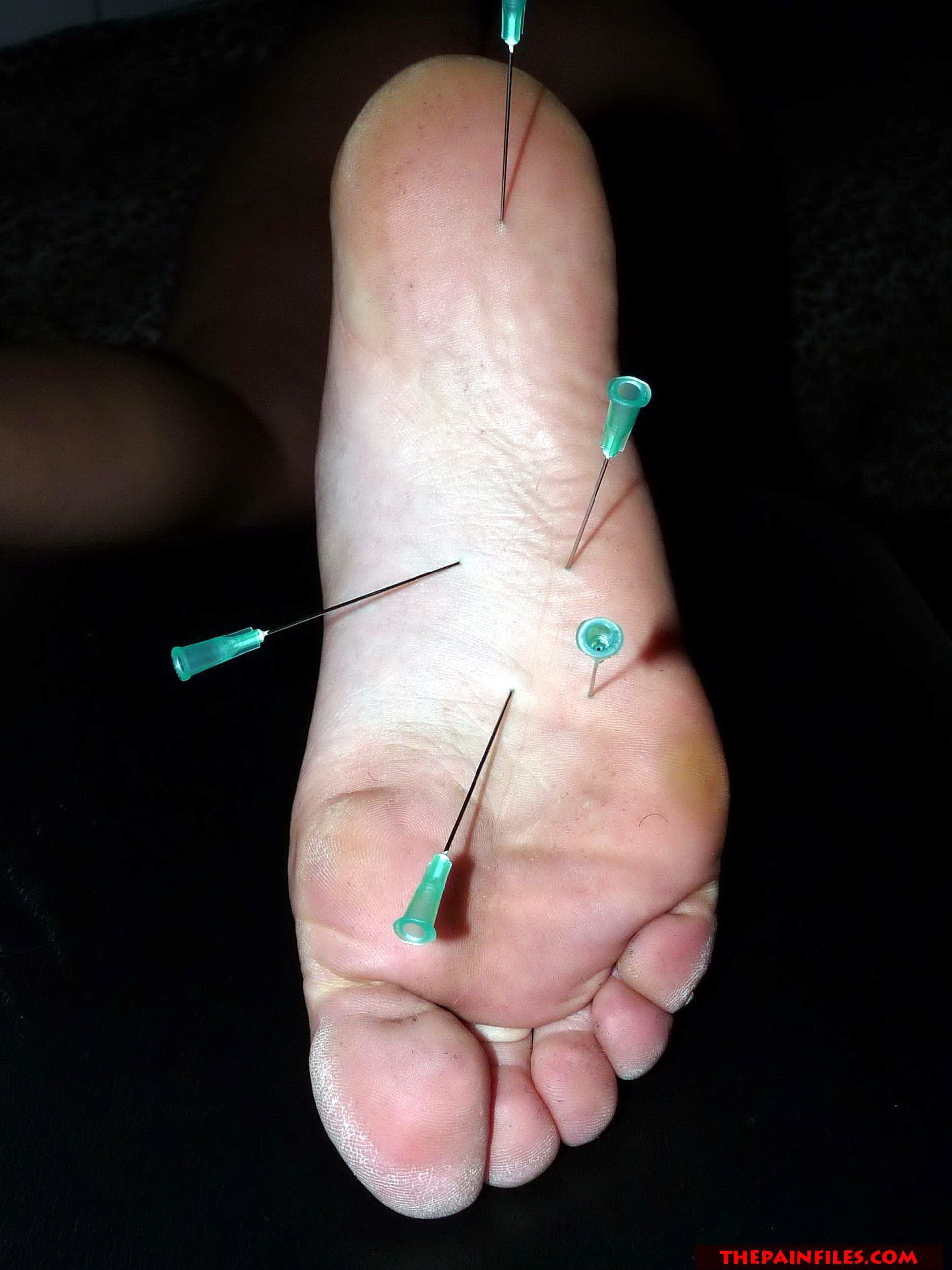 Feet torure needles toes